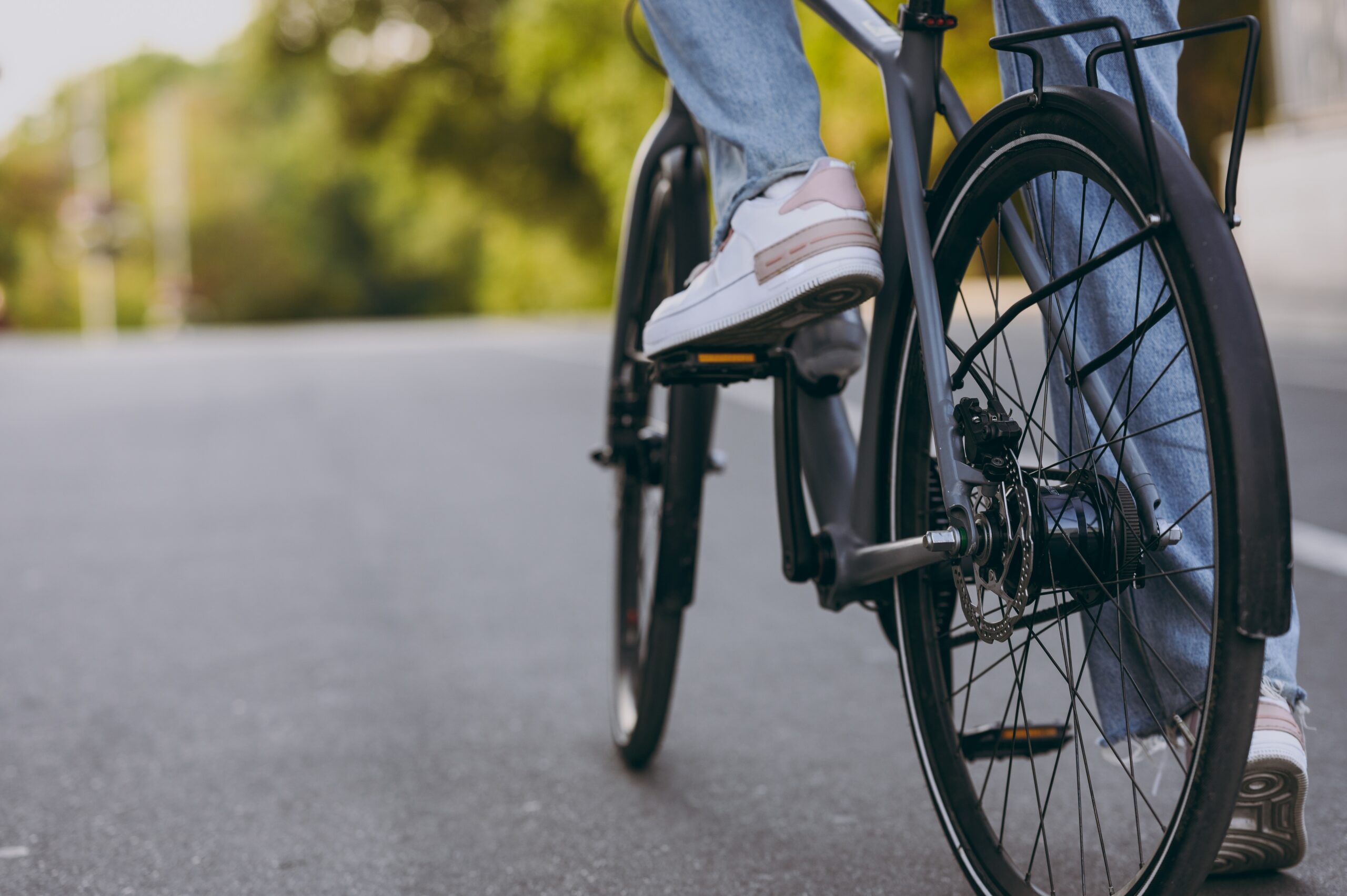 Cyclist riding safely on a Virginia road during Bike Safety Month.